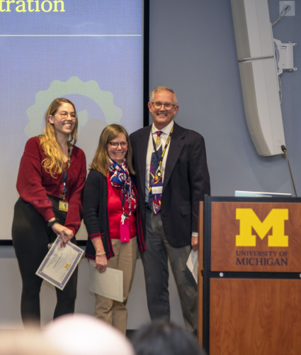 Stephanie Edwards and Regina Ferguson accepting awards from David Golden.
